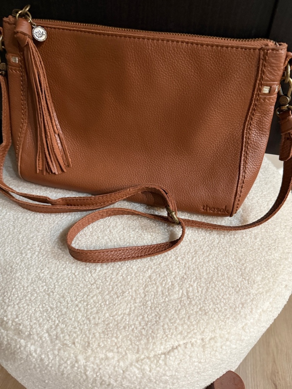 The Sak “Happy & Free” Crossbody Bag in Cognac Brown with Tassel